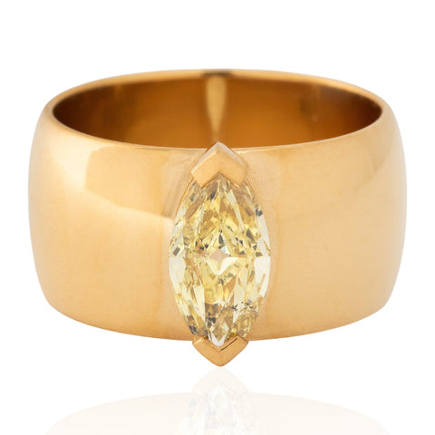 1.01ct GIA fancy yellow marquise cut diamond in a wide 22K gold cigar band ring