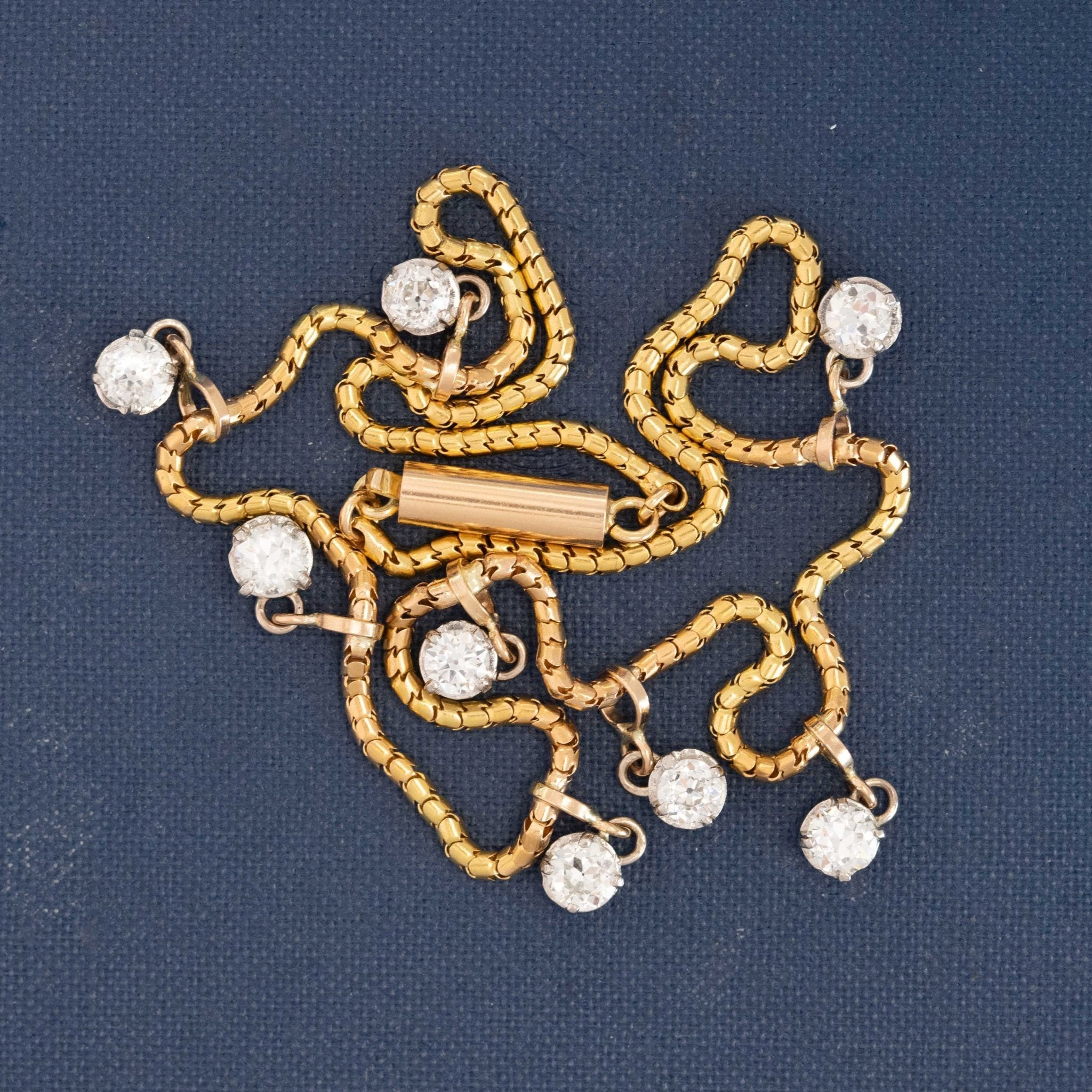 Elegant antique diamond necklace, yellow gold choker with scattered OEC diamonds for timeless sparkle.