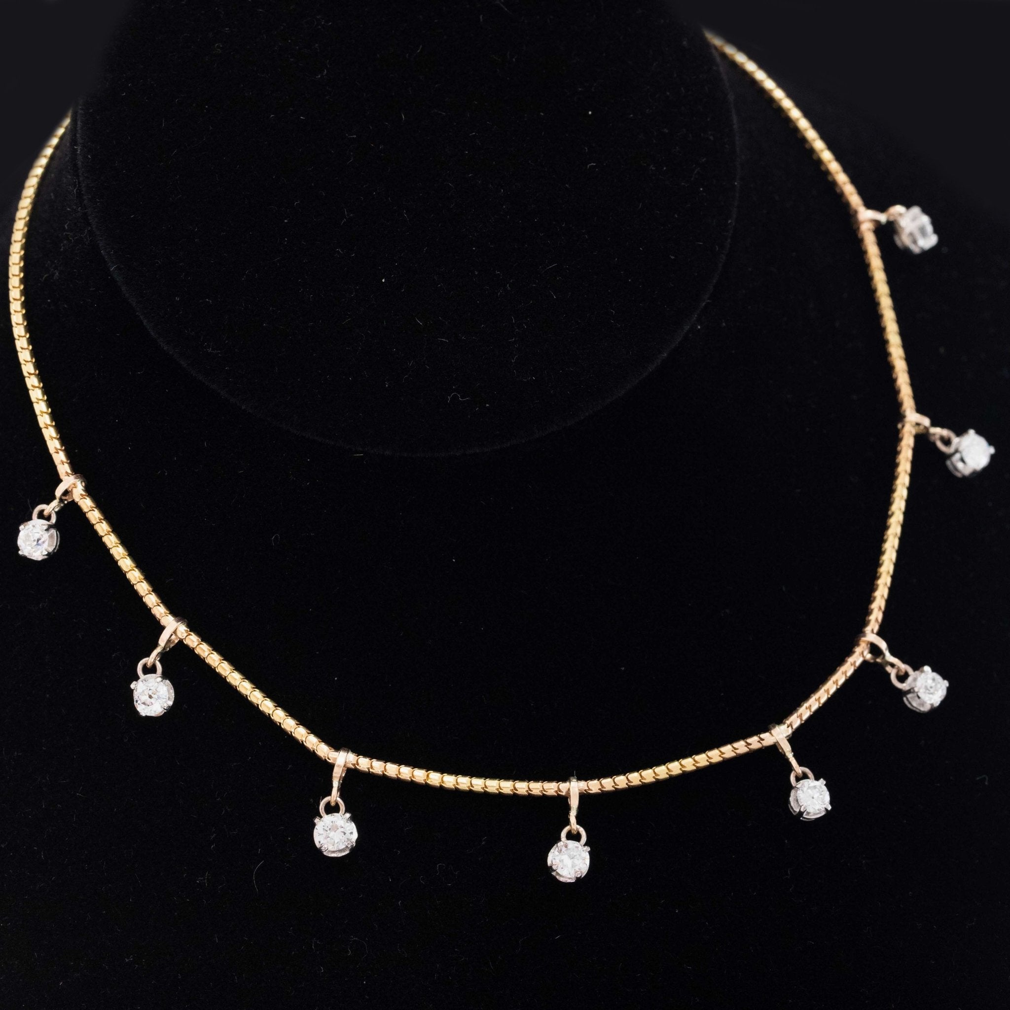 Vintage-inspired 14-inch diamond station necklace in buttery yellow gold with old European cut diamond accents.