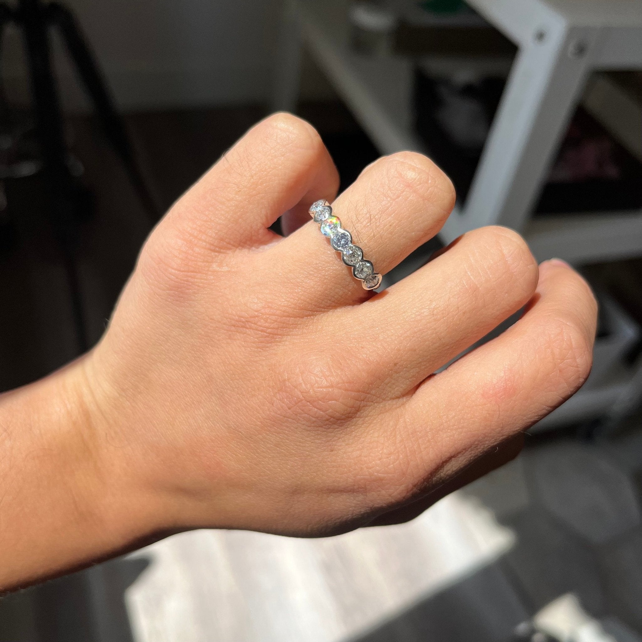 Elegant 1.00ctw Old European Cut Diamond Half Bezel Band, romantic design with Old European Cut Diamonds, Earth-mined diamonds in platinum shown on ring finger