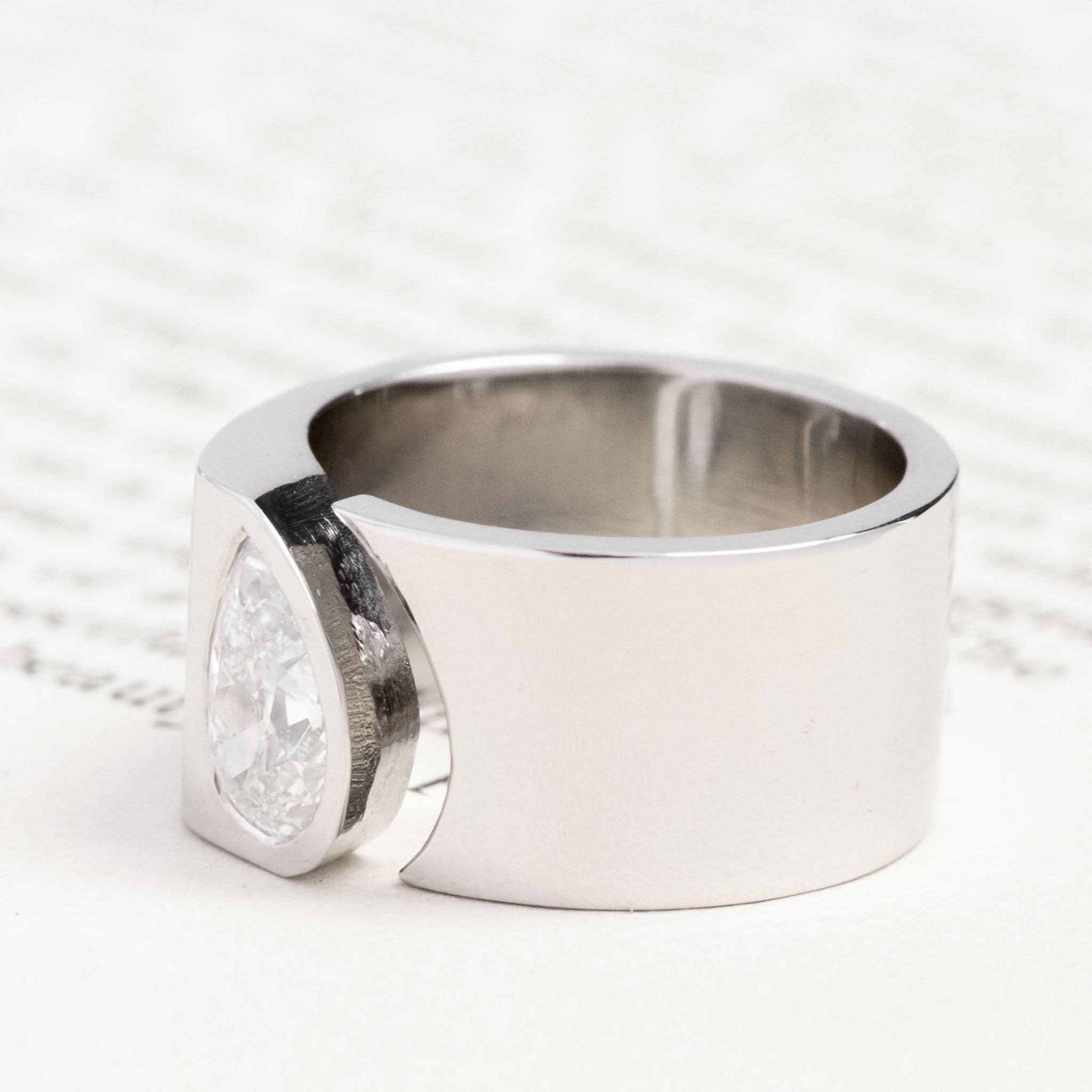 Antique lovers’ 1.01ct Pear Cut Diamond Open Cigar Band, GIA E in platinum, featuring rare Earth-mined Antique Diamonds