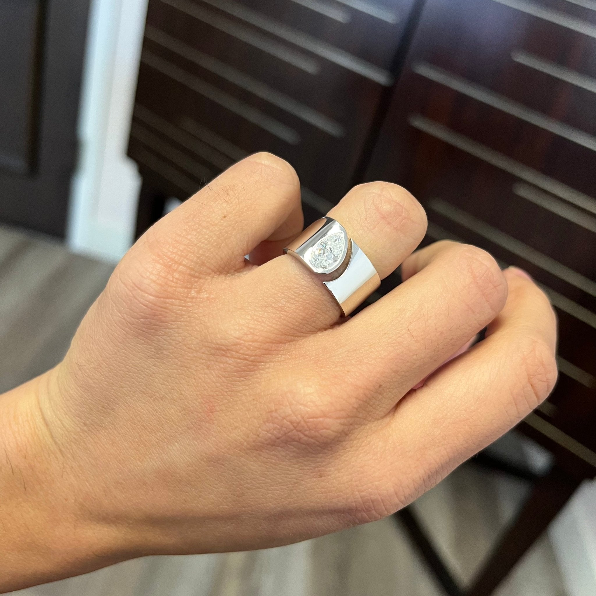 Elegant 1.01ct Pear Cut Diamond Open Cigar Band, GIA E, romantic design with Antique Diamonds, Earth-mined diamonds in platinum shown on ring finger