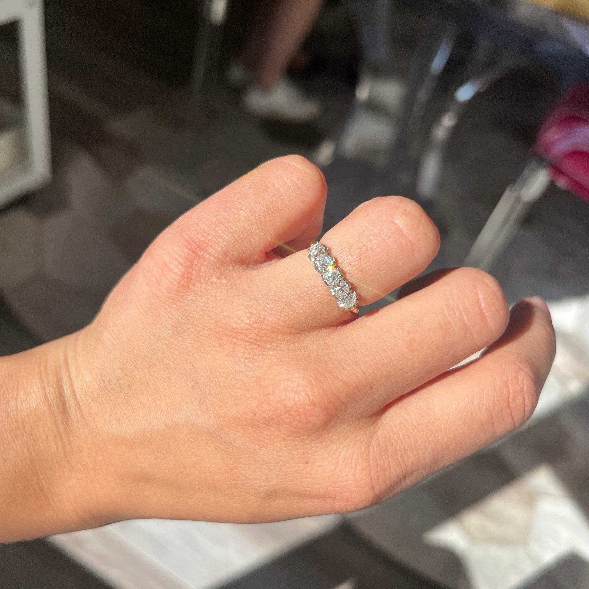 Elegant 1.01ctw Old Mine Cut Diamond 5-Stone Band, romantic design with Old Mine Cut Diamonds, Earth-mined diamonds in platinum and yellow gold shown on ring finger