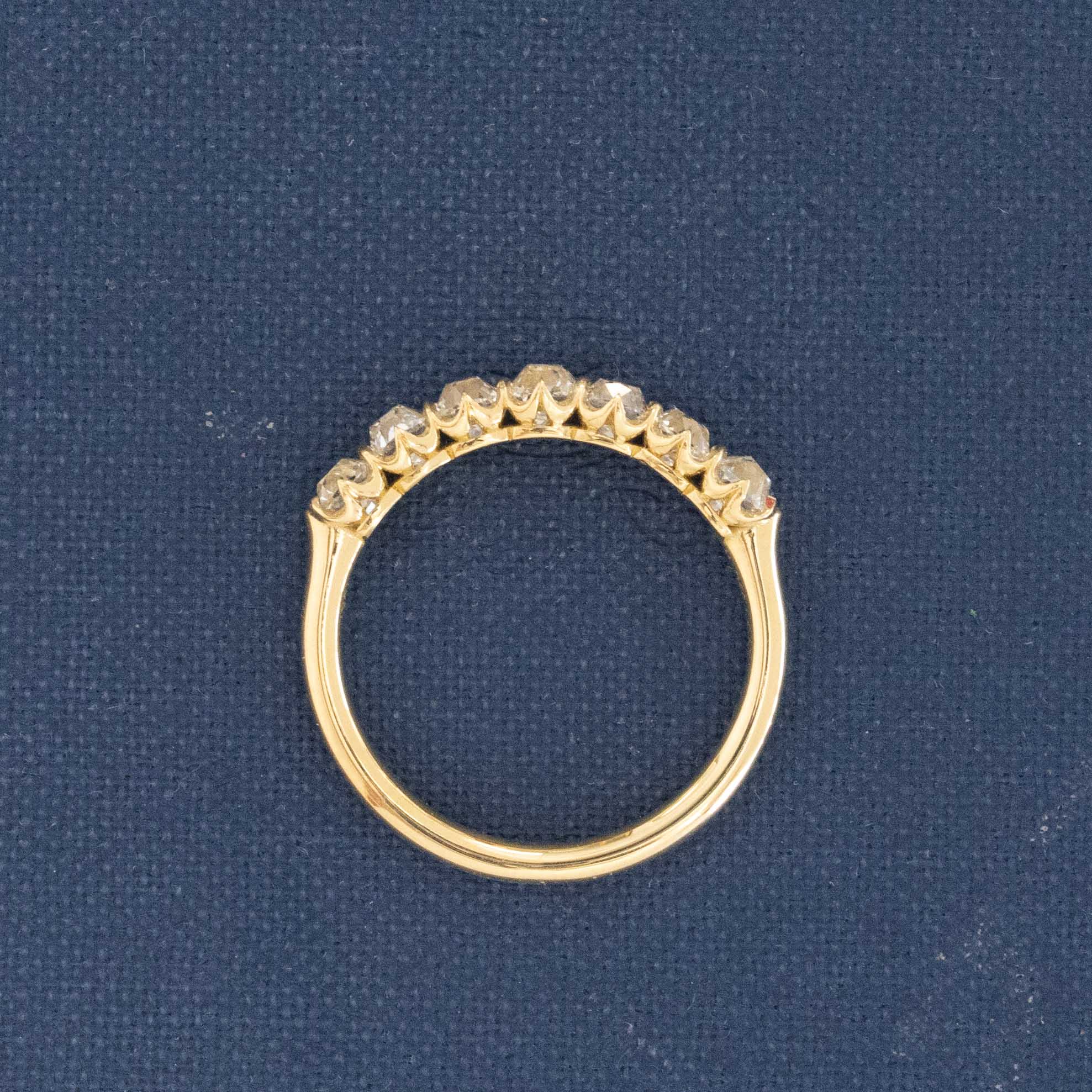 Side view of 1.03ctw Petite Old Mine Cut Diamond 7-Stone Half-Hoop Band, vintage-inspired band with Old Mine Cut Diamonds, crafted in yellow gold