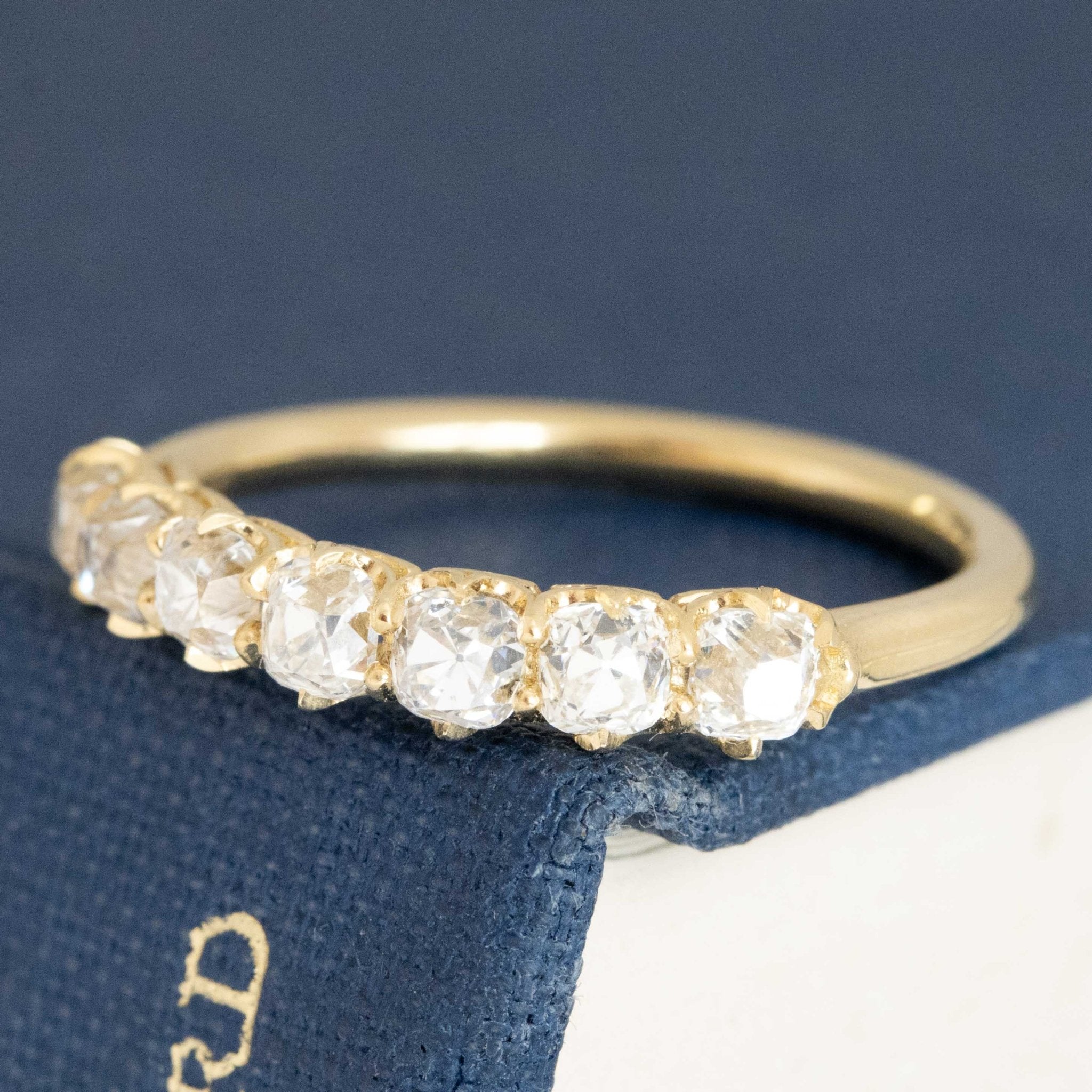 Antique lovers’ 1.03ctw Petite Old Mine Cut Diamond 7-Stone Half-Hoop Band in yellow gold, featuring rare Earth-mined Old Mine Cut Diamonds