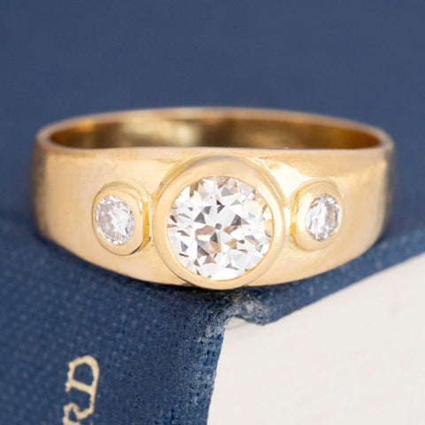Old European-cut diamond three-stone ring in 18k yellow gold