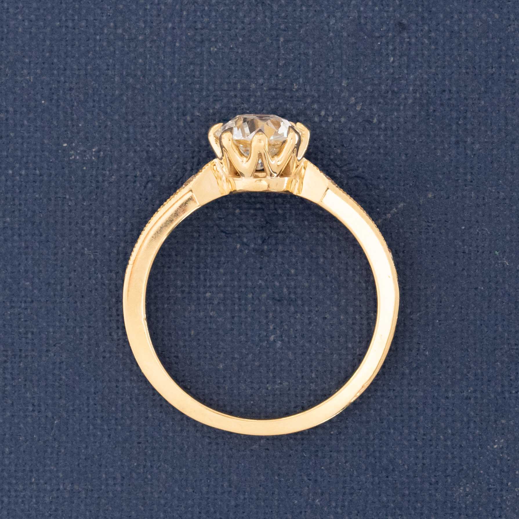 Old cut diamond engagement ring with pinched shoulders and antique-style sparkle.
