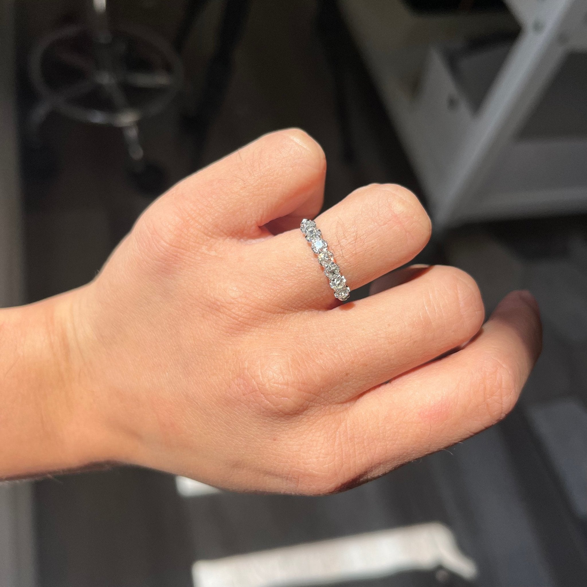 Elegant 1.04ctw Old Mine Cut Diamond Half-Hoop Band, romantic design with Old Mine Cut Diamonds, Earth-mined diamonds in platinum shown on ring finger