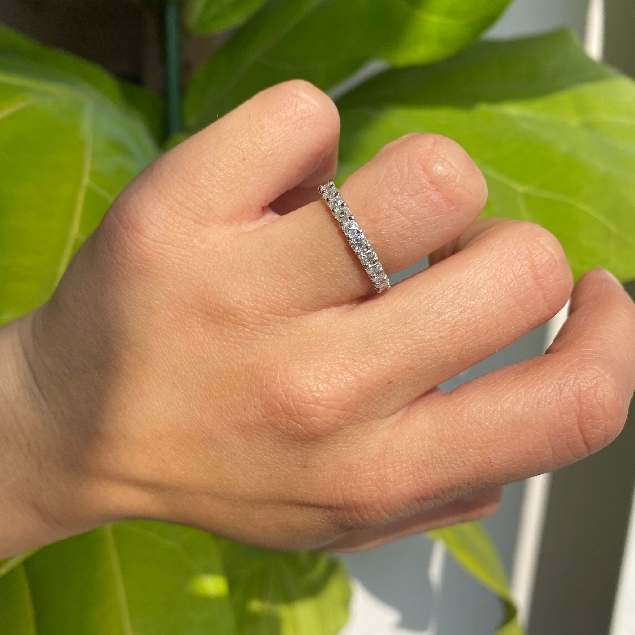 Elegant 1.05ctw Old Mine Cut Diamond Half-Eternity Band, romantic design with Old Mine Cut Diamonds, Earth-mined diamonds in platinum shown on ring finger