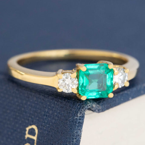1.05ctw Step Cut Emerald & Diamond Trilogy Ring