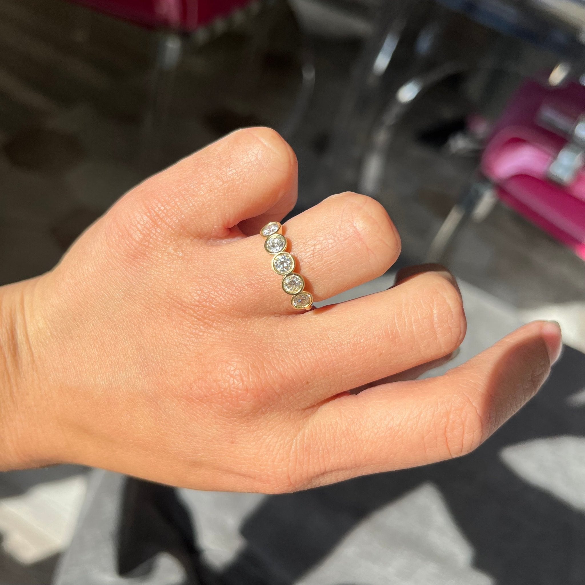 Elegant 1.07ctw Old European Cut Diamond 5-Stone Bezel Band, romantic design with Old European Cut Diamonds, Earth-mined diamonds in yellow gold shown on ring finger