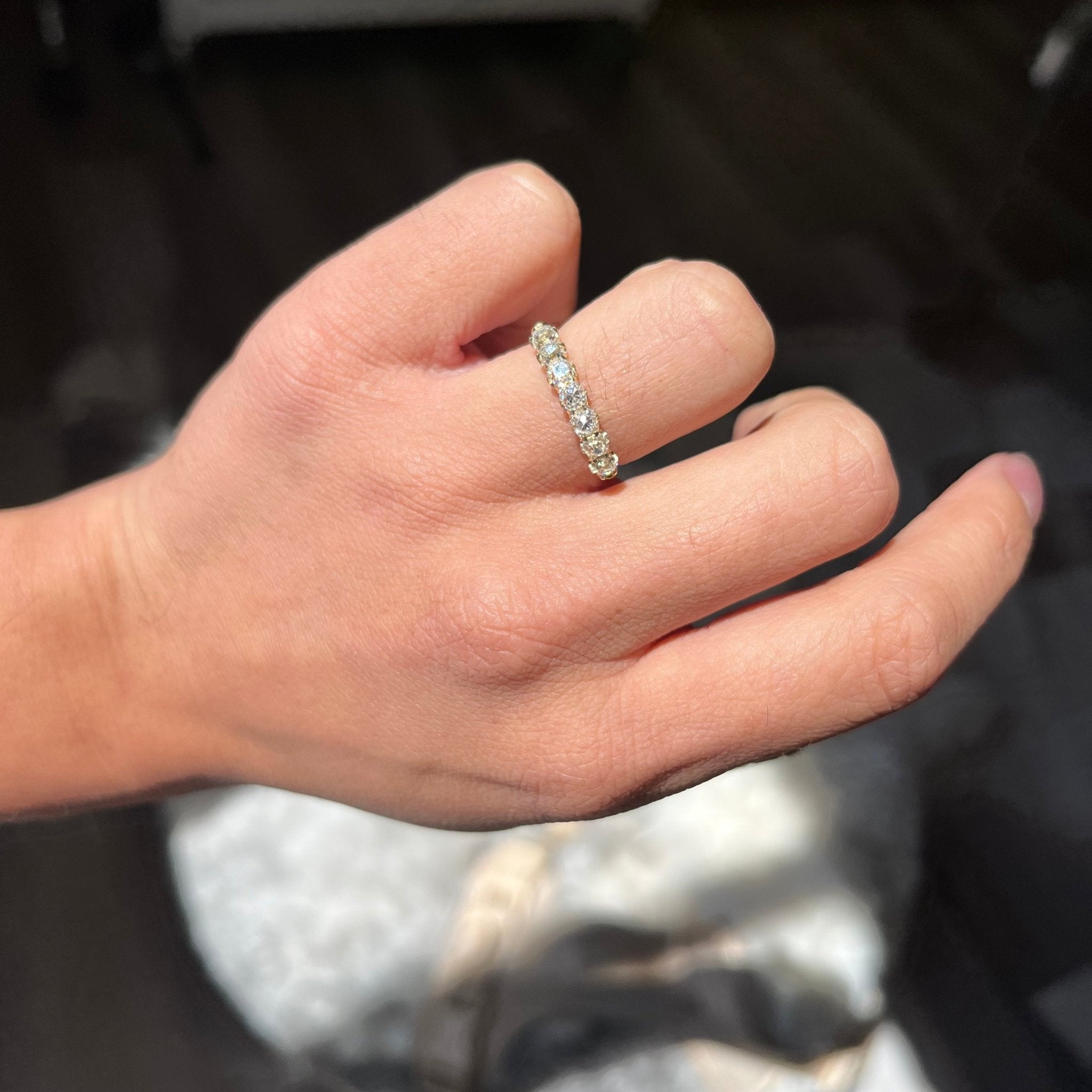 Elegant 1.07ctw Old Mine Cut Diamond Half-Hoop Band, romantic design with Old Mine Cut Diamonds, Earth-mined diamonds in yellow gold shown on ring finger