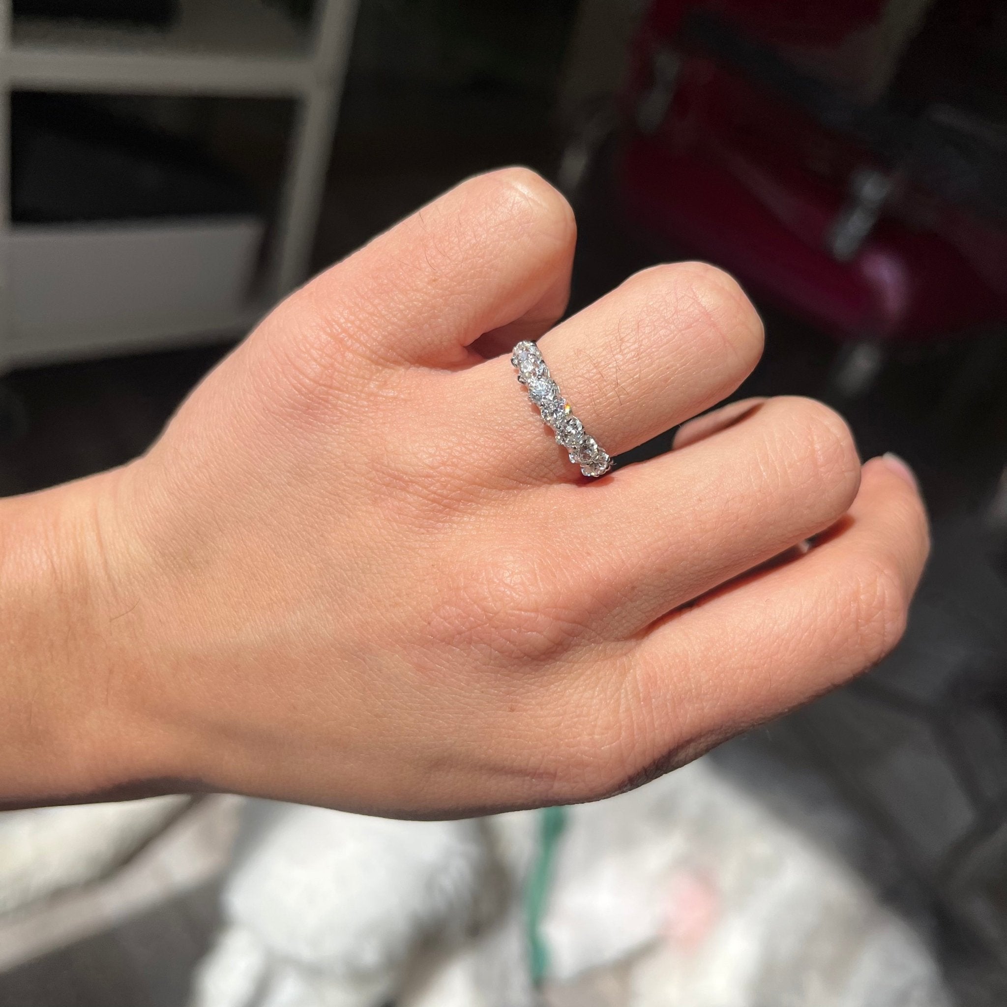 Elegant 1.08ctw Old European Cut Diamond Half-Hoop Band, romantic design with Old European Cut Diamonds, Earth-mined diamonds in platinum shown on ring finger