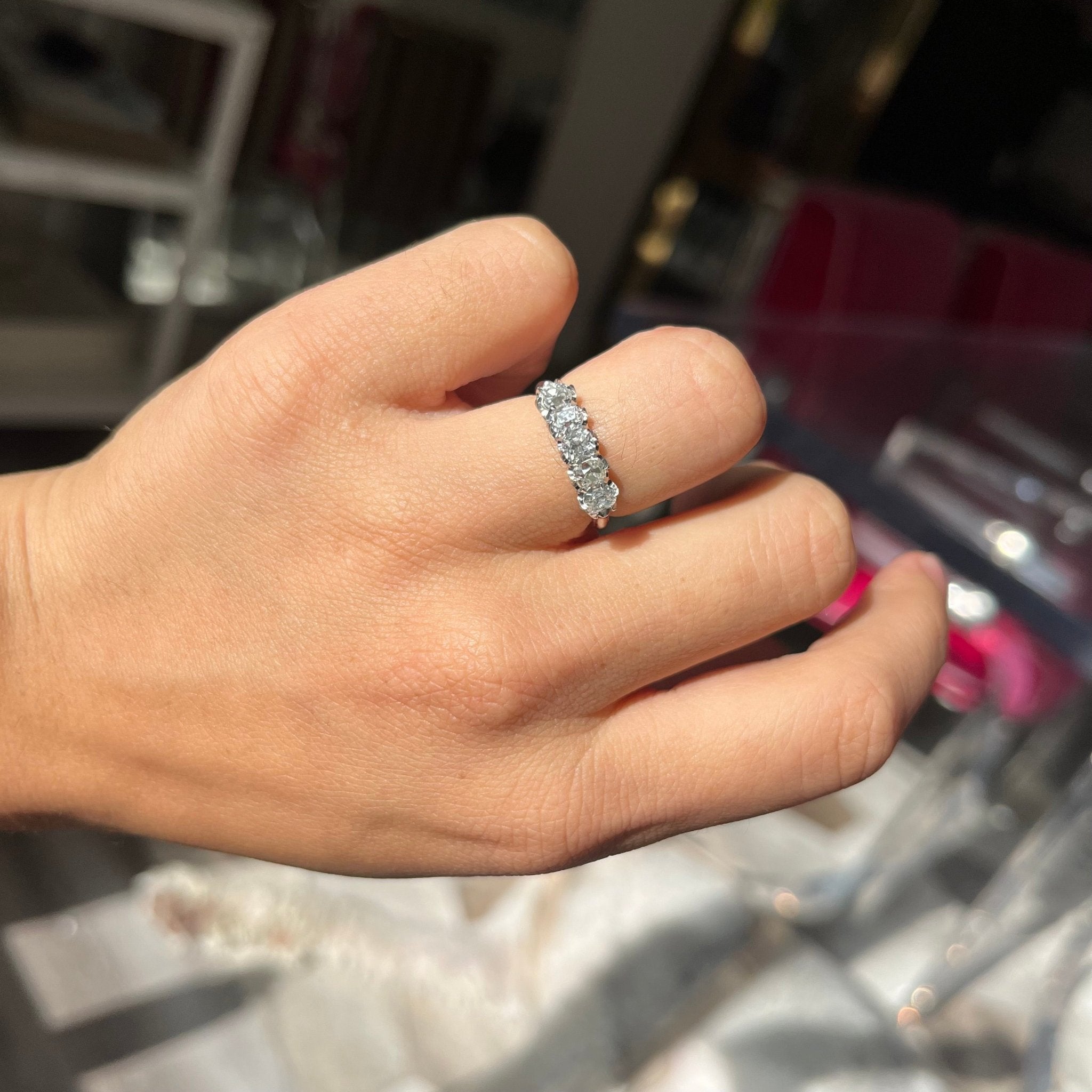 Elegant 1.08ctw Old Mine Cut Diamond 5-StoneHalf-Hoop Band, romantic design with Old Mine Cut Diamonds, Earth-mined diamonds in platinum shown on ring finger