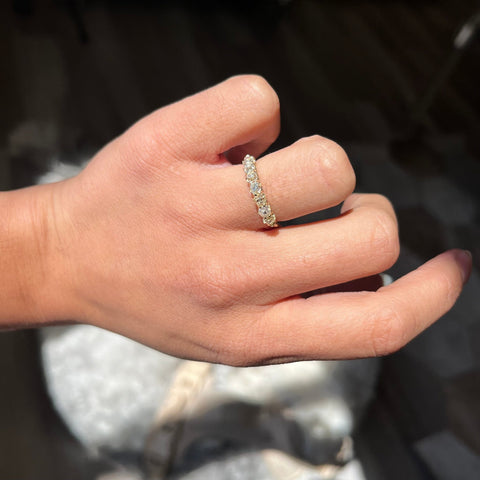 Elegant 1.09ctw Old Mine Cut Diamond Half-Hoop Band, romantic design with Old Mine Cut Diamonds, Earth-mined diamonds in yellow gold shown on ring finger