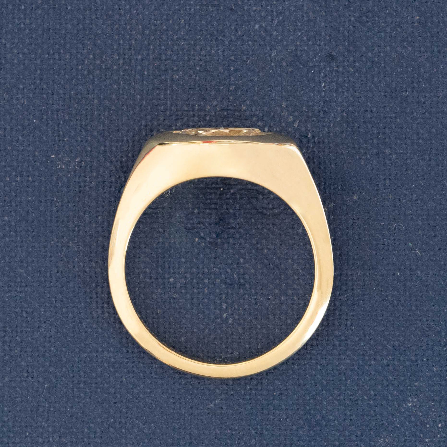Ring shot: 1.11ct marquise bezel solitaire on finger, highlighting East-West orientation