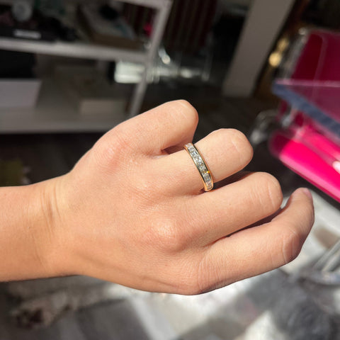 Elegant 1.11ctw French Baguette Cut Diamond Half Eternity Band, romantic design with Baguette Cut Diamonds, Earth-mined diamonds in yellow gold shown on ring finger