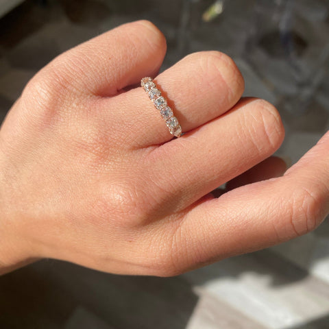 Elegant 1.11ctw Old Mine Cut Diamond 7-Stone Half-Hoop Band, romantic design with Old Mine Cut Diamonds, Earth-mined diamonds in rose gold shown on ring finger