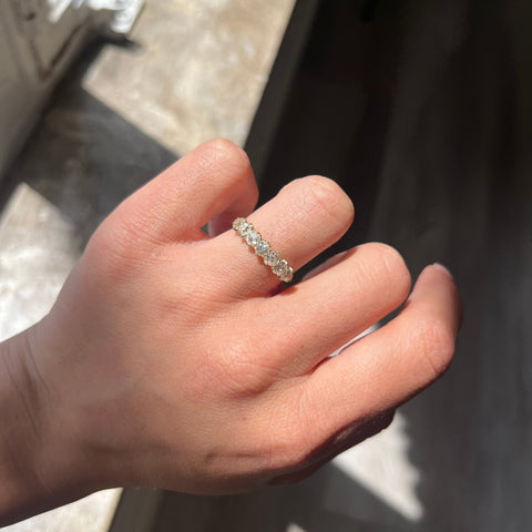Elegant 1.11ctw Old Mine Cut Diamond Half-Hoop Band, romantic design with Old Mine Cut Diamonds, Earth-mined diamonds in yellow gold shown on ring finger
