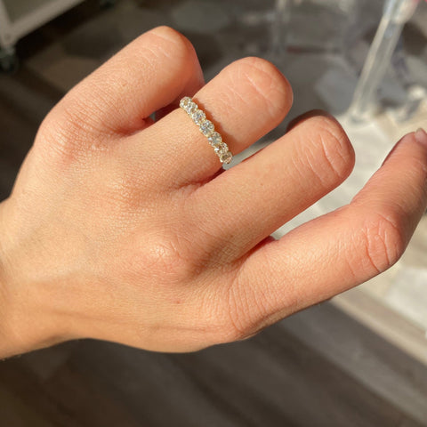 Elegant 1.14ctw Old Mine Cut Diamond 7-Stone Band, romantic design with Old Mine Cut Diamonds, Earth-mined diamonds in yellow gold shown on ring finger