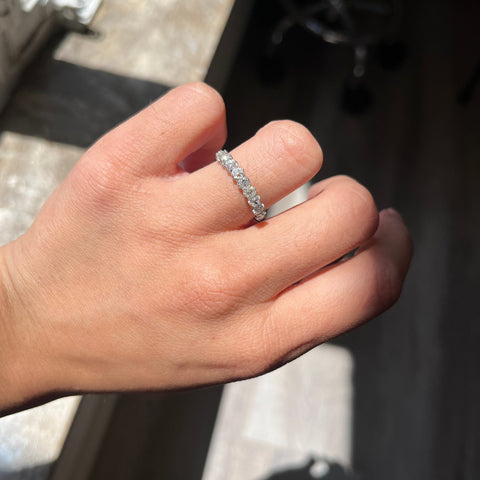 Elegant 1.15ctw Old Mine Cut Diamond 9-Stone Half-Hoop Band, romantic design with Old Mine Cut Diamonds, Earth-mined diamonds in platinum shown on ring finger