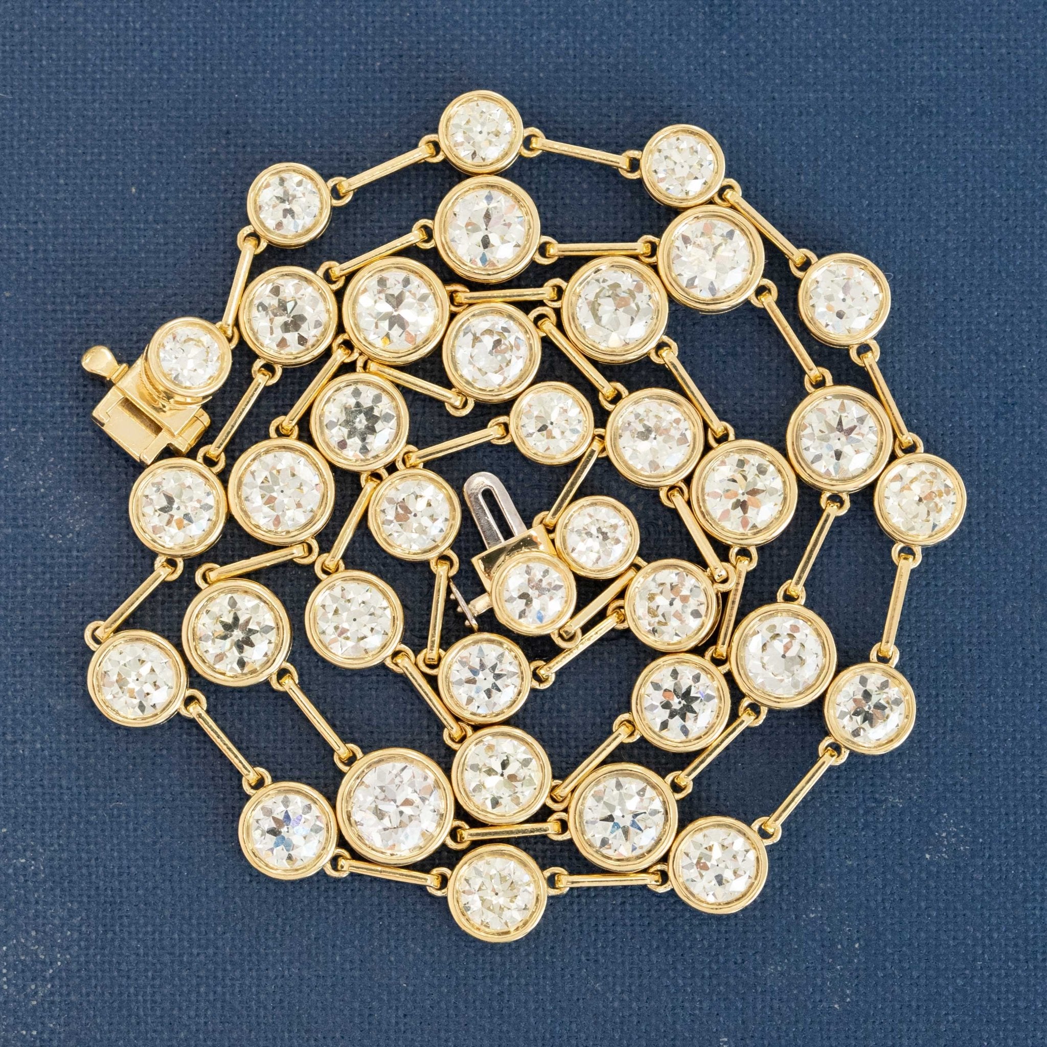 Elegant 18 inch 18k yellow gold necklace featuring 12.15ctw Old European cut diamonds