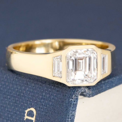1.31ctw Emerald Cut Diamond Bezel Trilogy Ring
