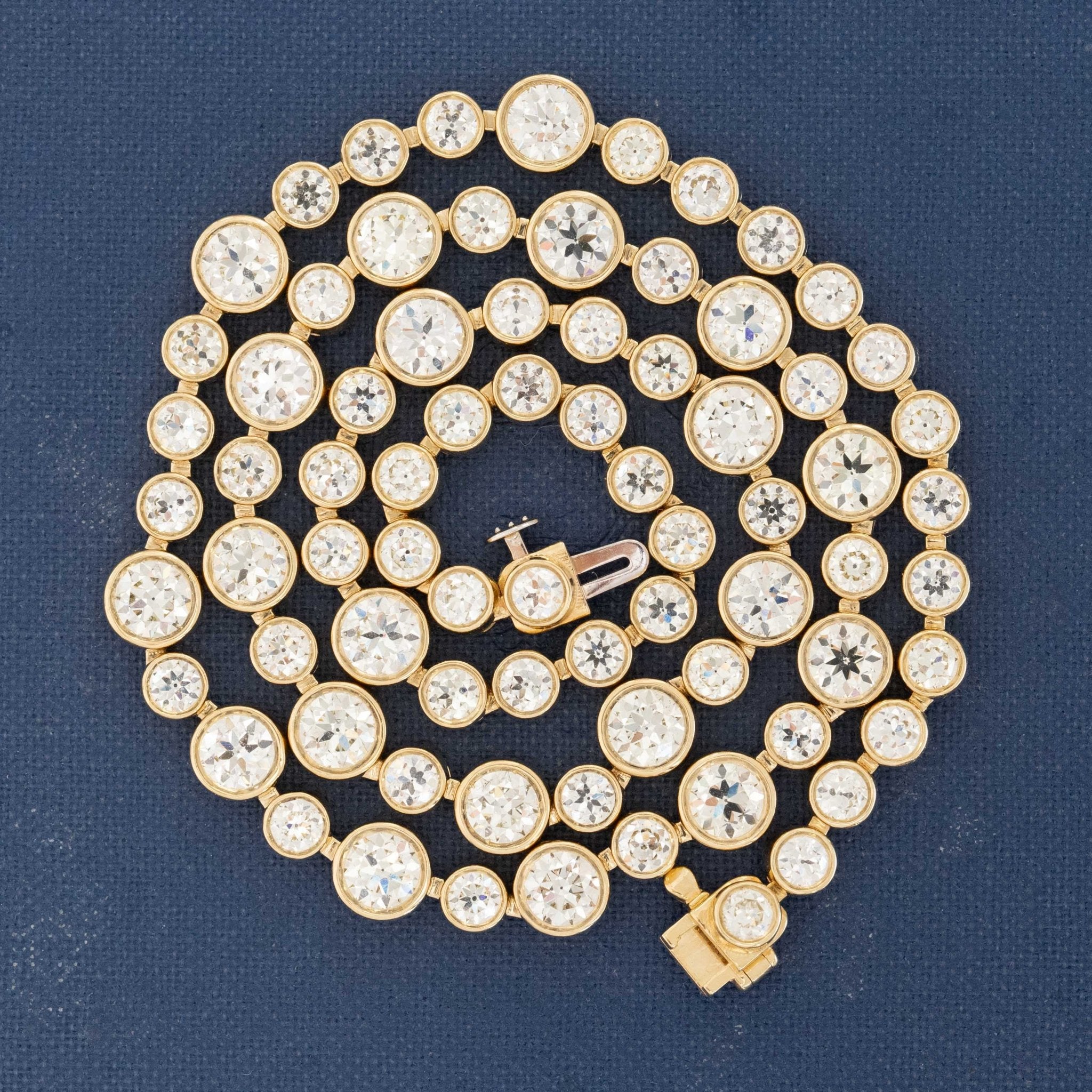 Antique diamond necklace featuring bezel-set Old European cut diamonds, 16 inches in length.