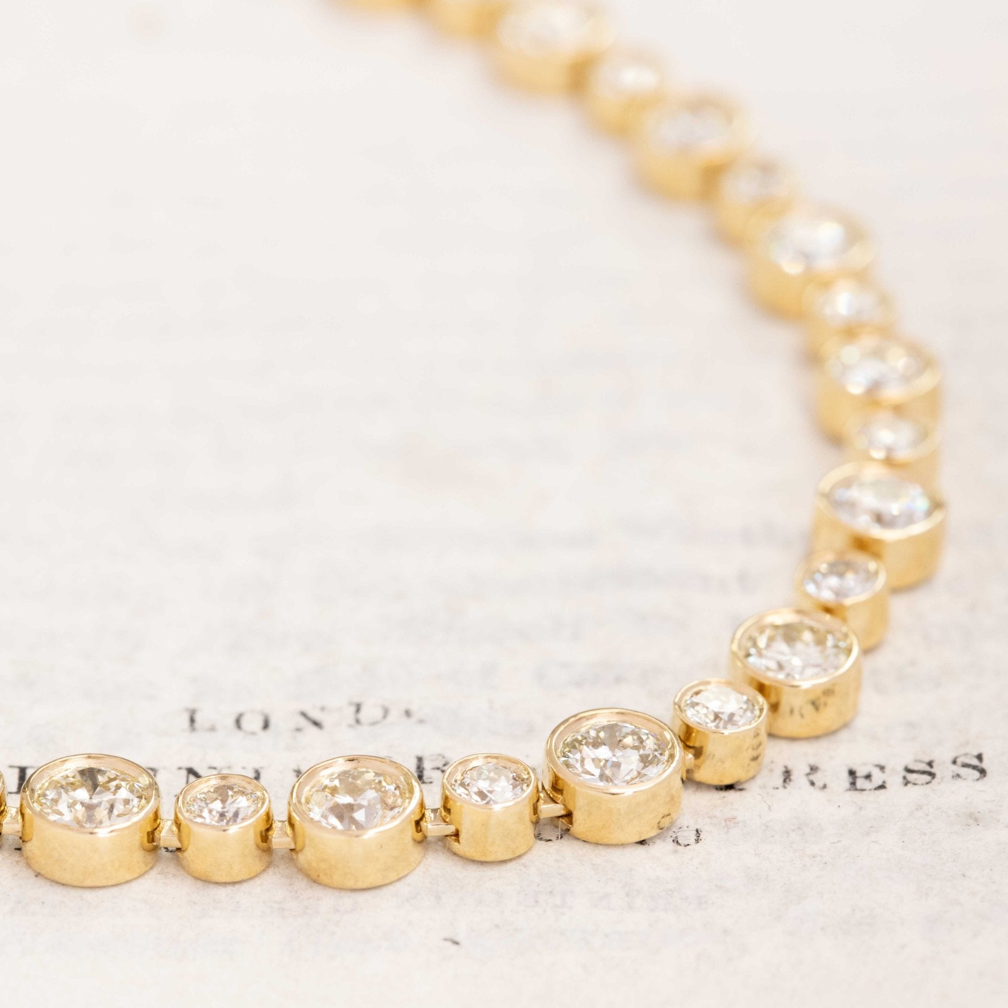 Gold bezel diamond necklace with over 15 carats of Old European cut diamonds, 18k yellow gold.