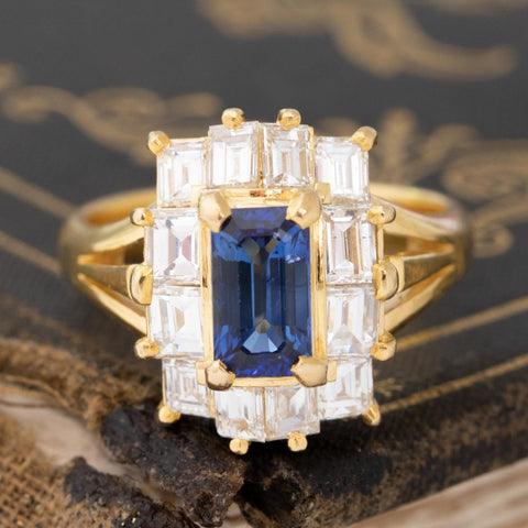 2.55ctw vintage emerald cut blue sapphire and step cut diamond ballerina ring in 18kt yellow gold
