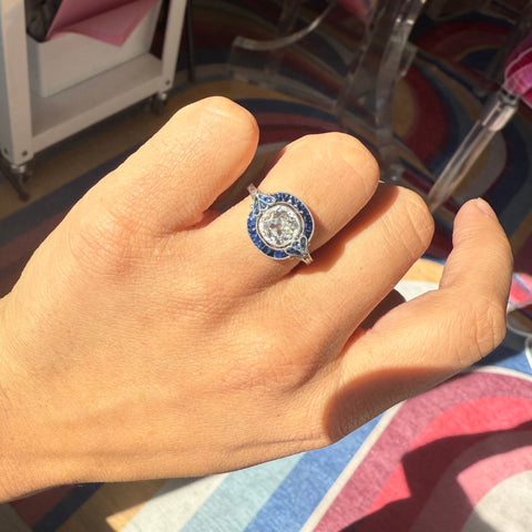 Vintage style halo ring old mine cut diamond surrounded by sapphires yellow gold