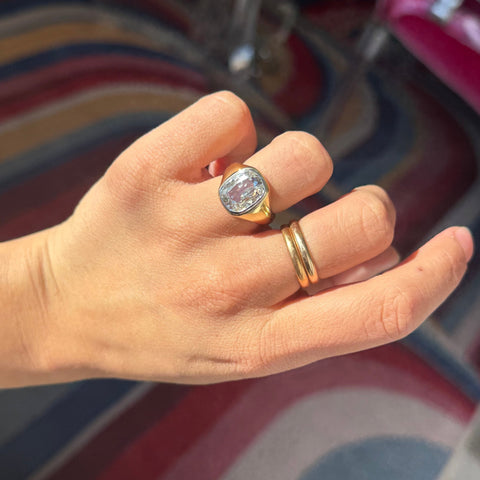 Antique elongated OMC diamond ring in gold bezel setting