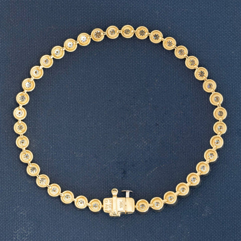 Vintage JbyG tennis bezel bracelet showcasing Old European cuts and gold setting