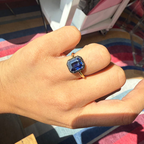 Hand shot view and Top-down of the deep blue, velvety Ceylon sapphire solitaire ring