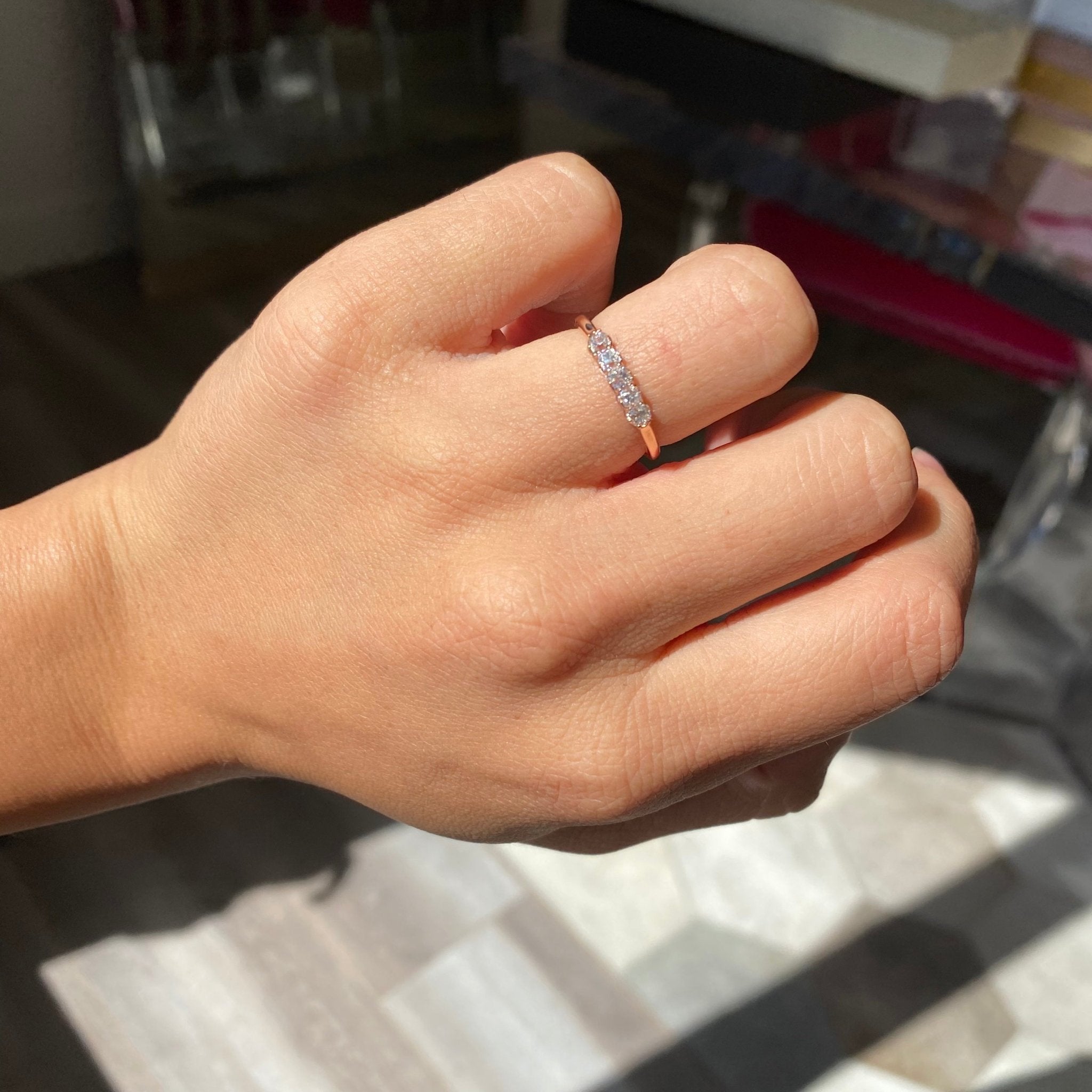 Elegant .38ctw Petite Old Mine Cut Diamond Band, romantic design with Old Mine Cut Diamonds, Earth-mined diamonds in rose gold on ring finger.