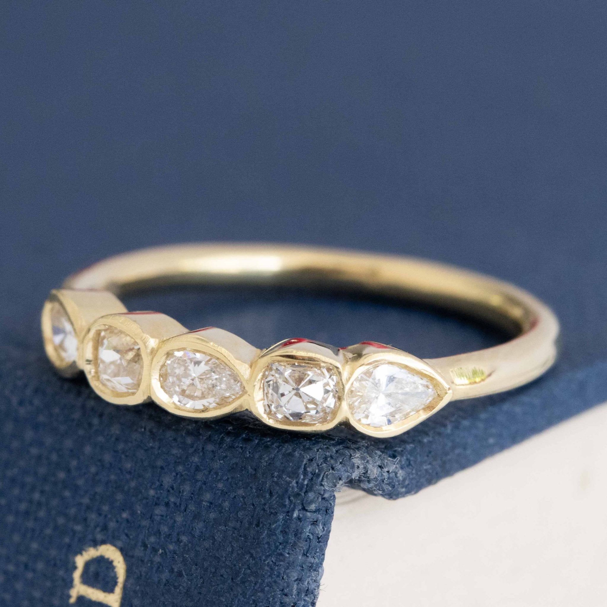 Antique lovers’ .41ctw Petite Mixed Cut Diamond Bezel Band in yellow gold, featuring rare Earth-mined Old Mine Cut Diamonds.