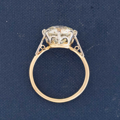 Side view of collector’s antique diamond solitaire with transitional cut and intricate details.