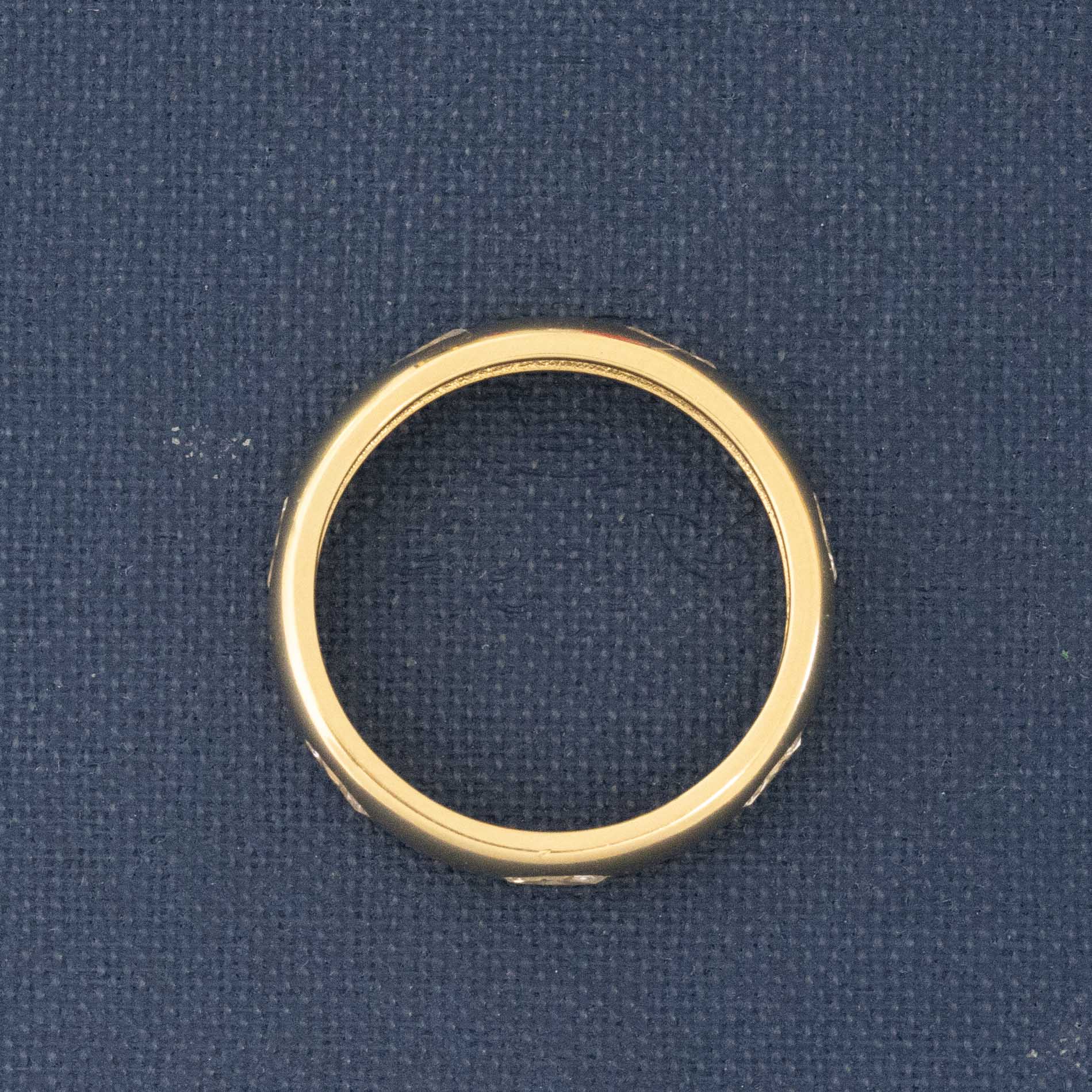 Side view of .44ctw Vintage Marquise Cut Diamond Eternity Band, natural Earth-mined Antique Diamonds, unique heirloom in yellow gold.