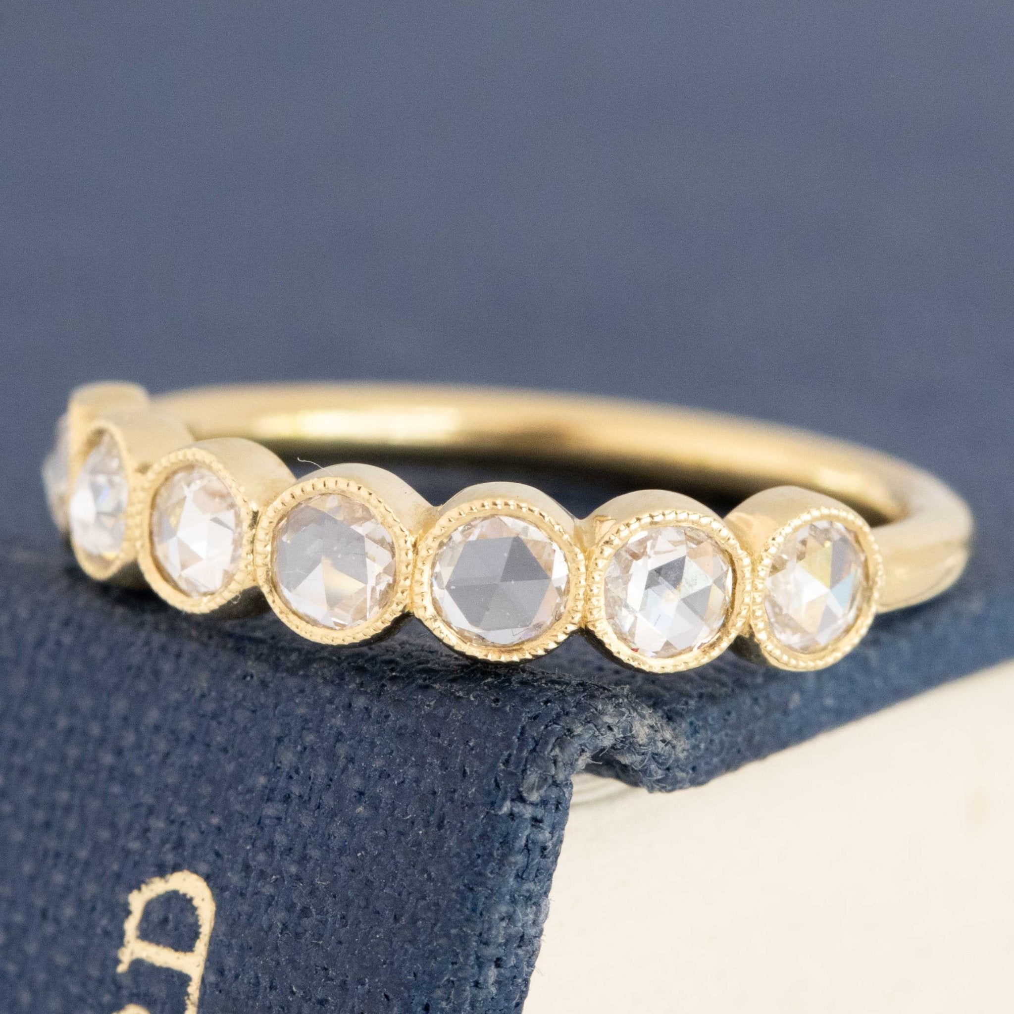 Close-up of .47ctw Round Rose Cut Diamond Bezel Half-Hoop Band, vintage-inspired band with Antique Diamonds, unique heirloom crafted in yellow gold