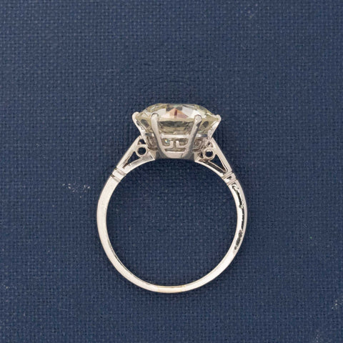Side view of antique platinum diamond ring featuring 4.93ct Old European Cut center stone.
