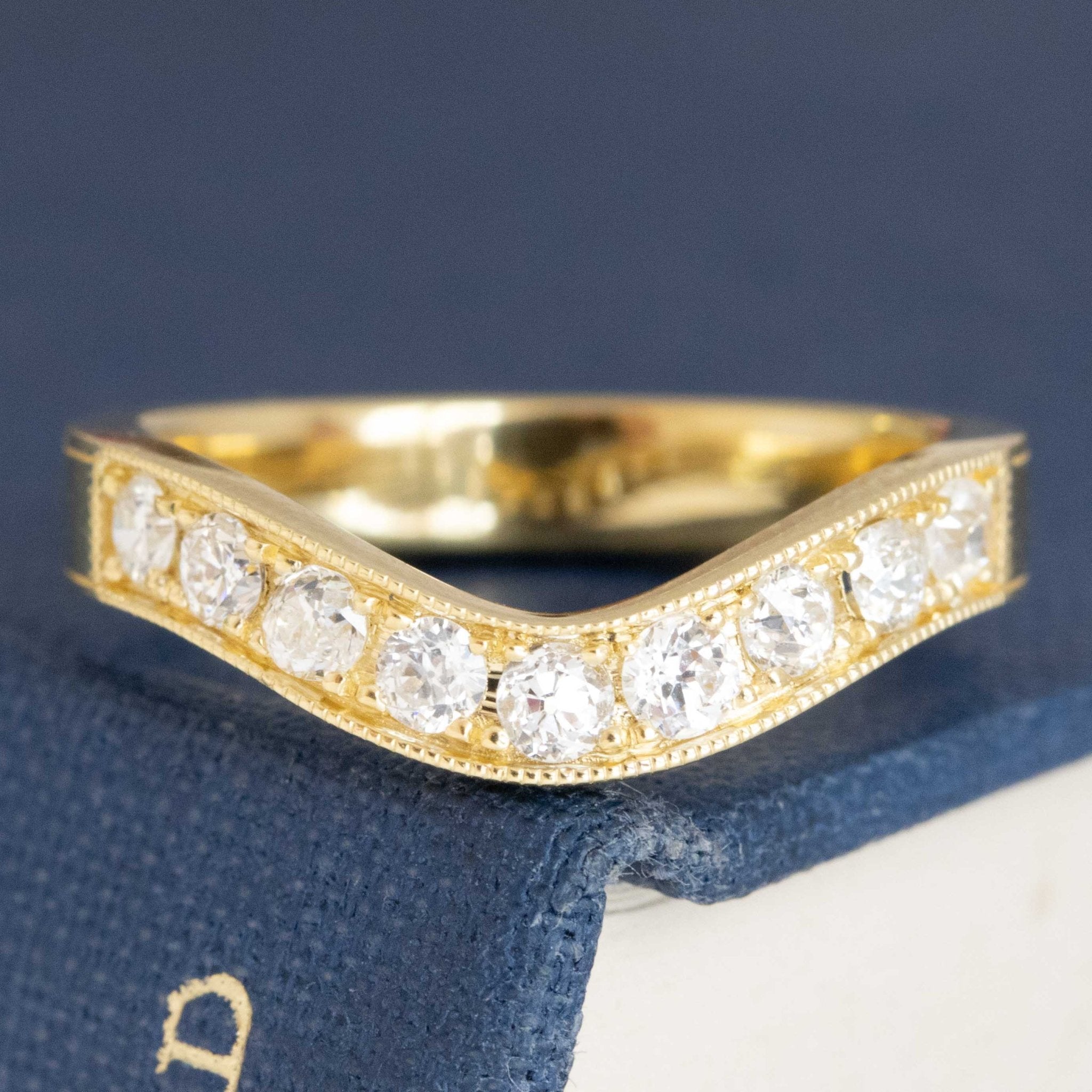 Antique lovers’ .49ctw Old European Cut Diamond Curved Band in yellow gold, featuring rare Earth-mined Old European Cut Diamonds.