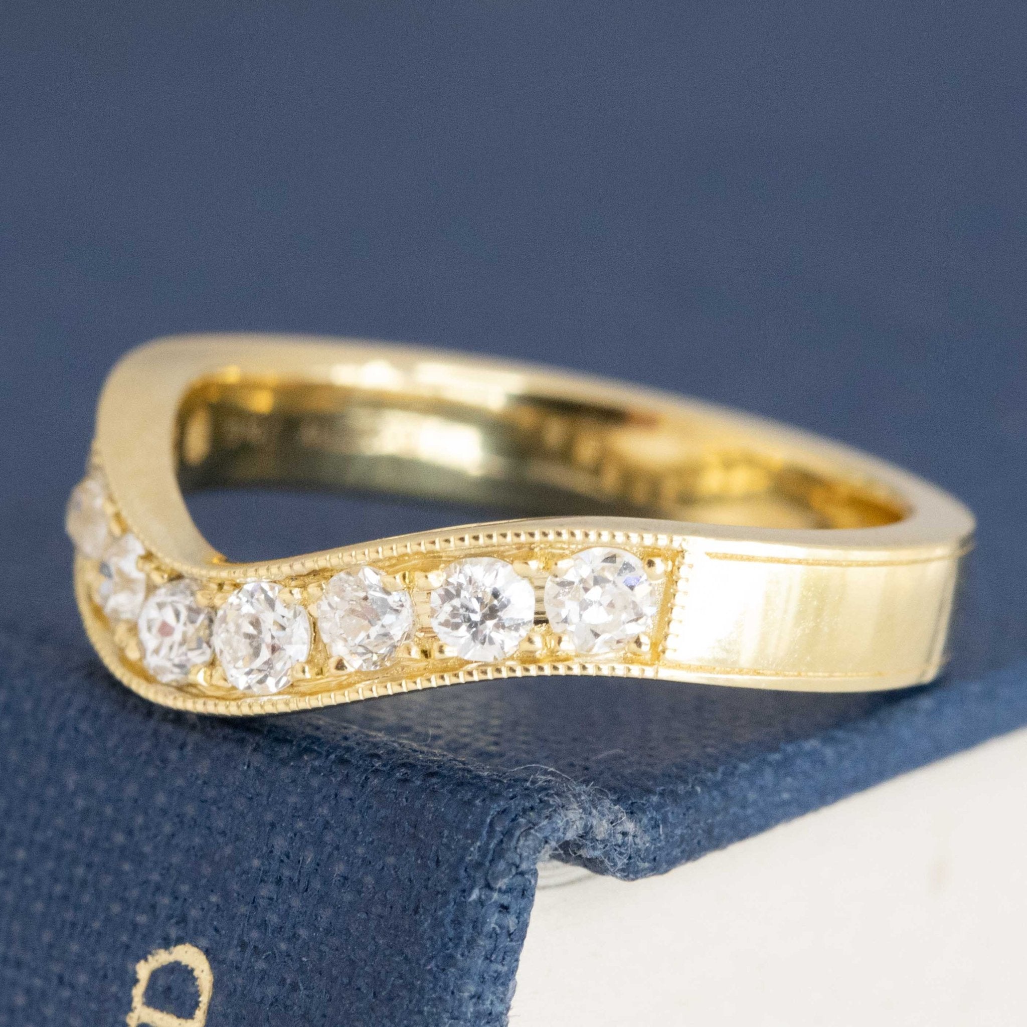 Side view of .49ctw Old European Cut Diamond Curved Band, natural Earth-mined Old European Cut Diamonds in yellow gold.