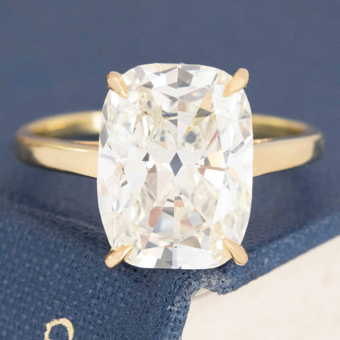 Timeless cushion cut engagement ring with brilliant face-up sparkle.