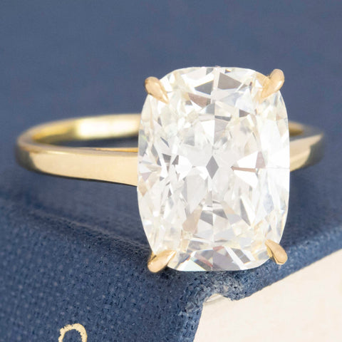 Elongated cushion cut diamond ring with 7ct face-up look.