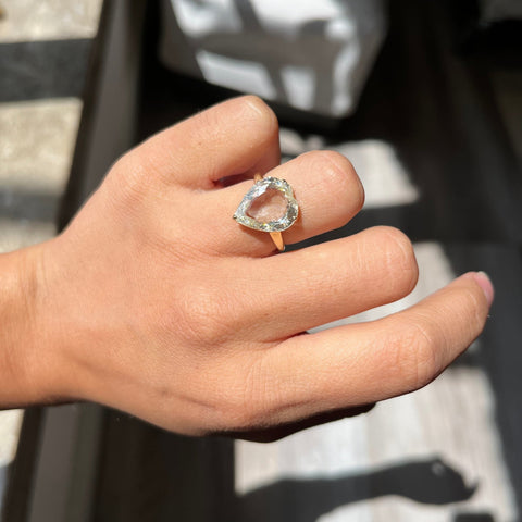 Unique “peart” shaped diamond ring — heart and pear hybrid rose cut shown on model.