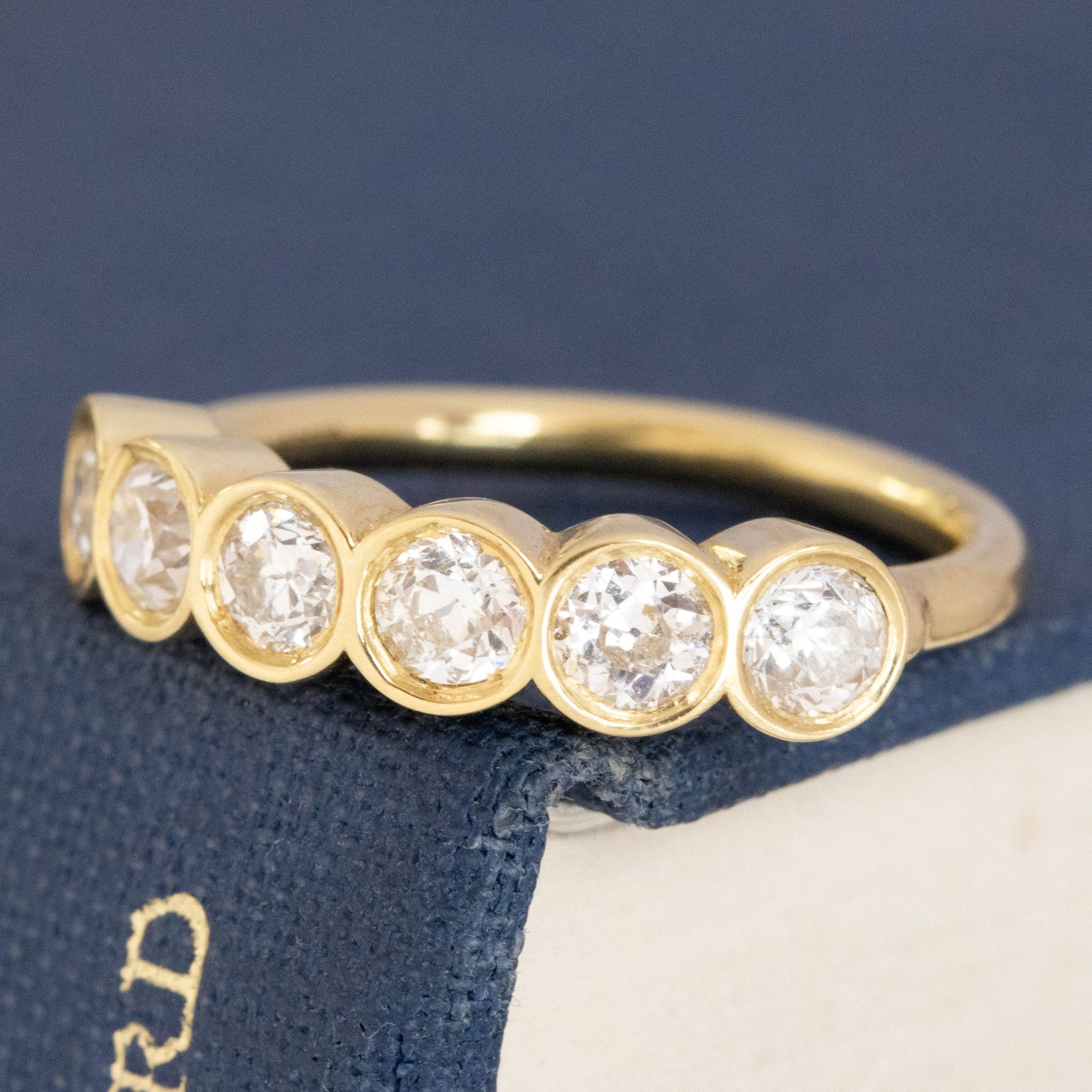 Antique lovers’ .52ctw Old European Cut Diamond 6-Stone Bezel Band in yellow gold, featuring rare Earth-mined Old European Cut Diamonds.