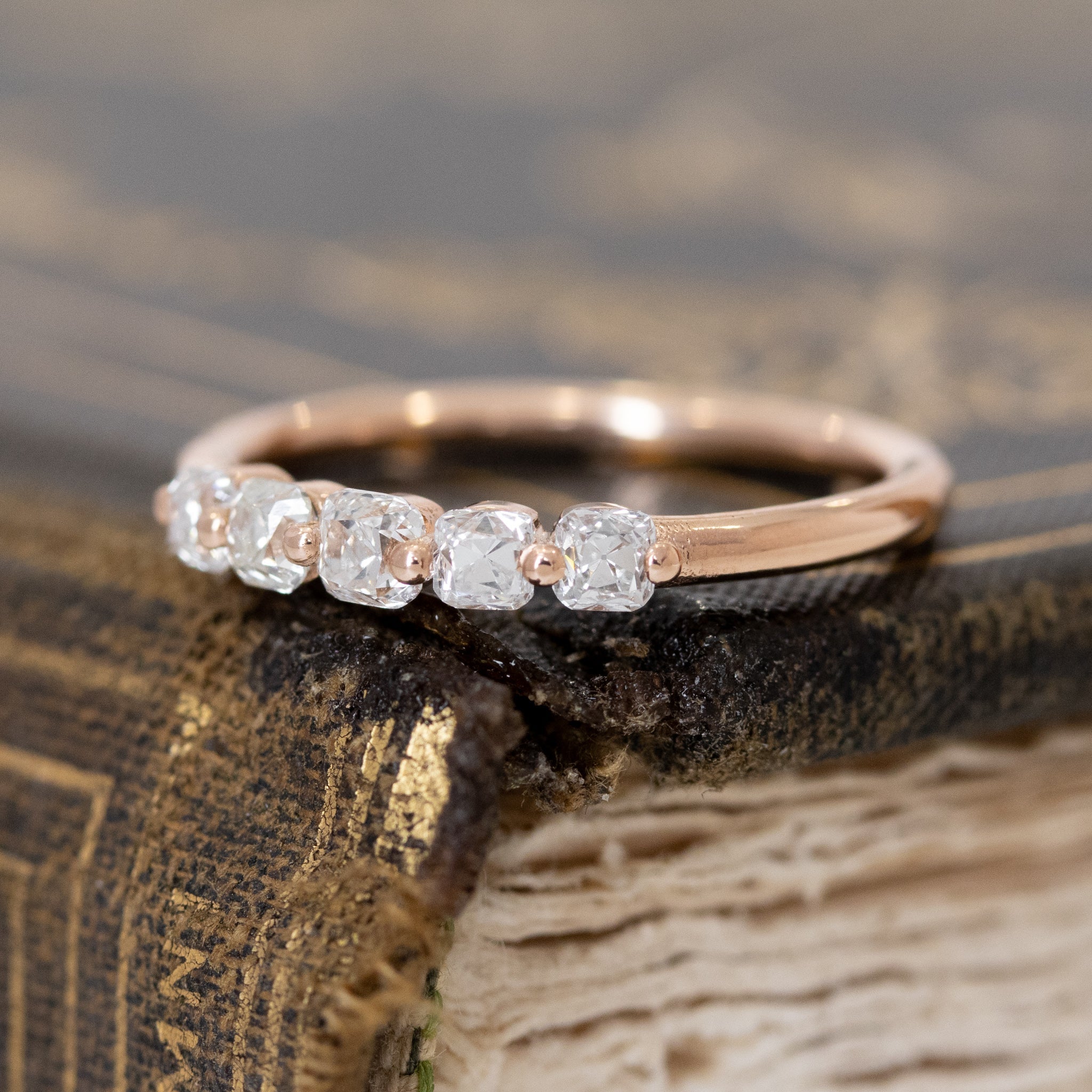 Antique lovers’ .53ctw Old Mine Cut Diamond Shared Prong Band in rose gold, featuring rare Earth-mined Old Mine Cut Diamonds.