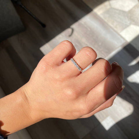 Elegant .53ctw Petite Old Mine Cut Diamond Band, romantic design with Old Mine Cut Diamonds, Earth-mined diamonds in platinum shown on ring finger.