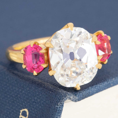 GIA certified 4.12ct I SI2 Old Mine Cut diamond with spinel shoulders.