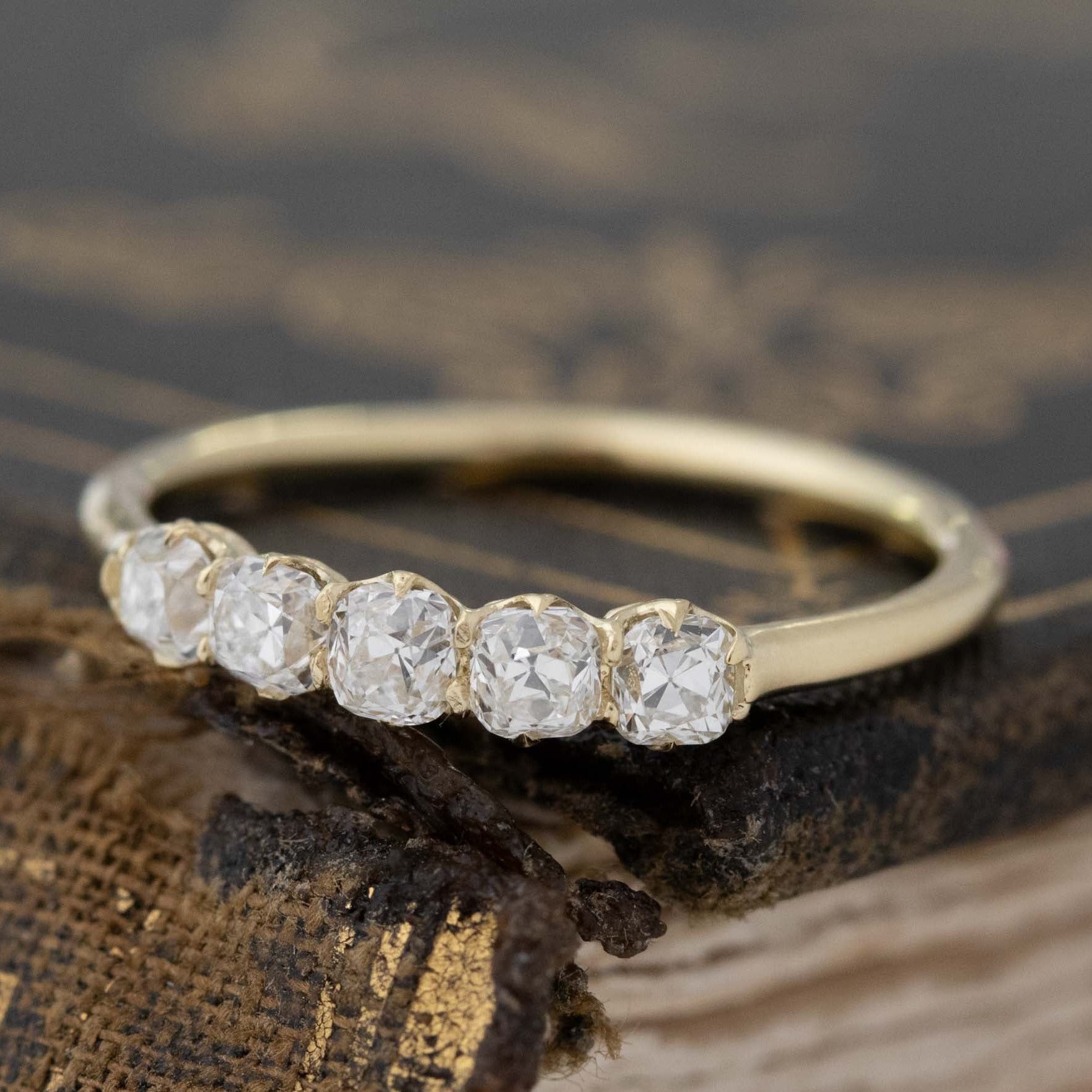Close-up of .55ctw Petite Old Mine Cut Diamond 5-Stone Band, vintage-inspired band with Old Mine Cut Diamonds, crafted in yellow gold.